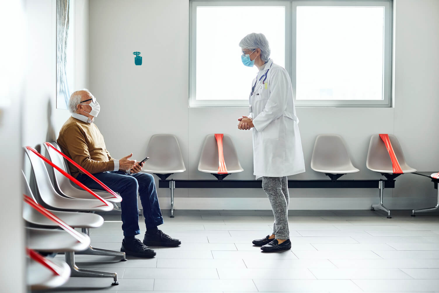 a doctor talking to a patient in hostpical