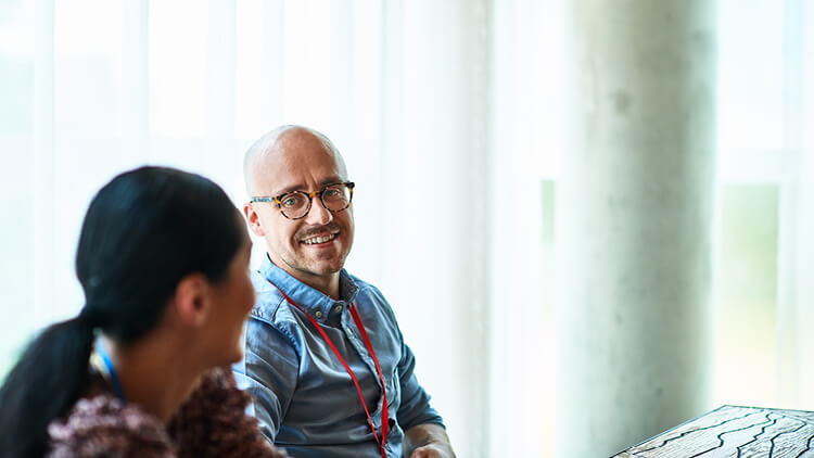 Two business people in conversation