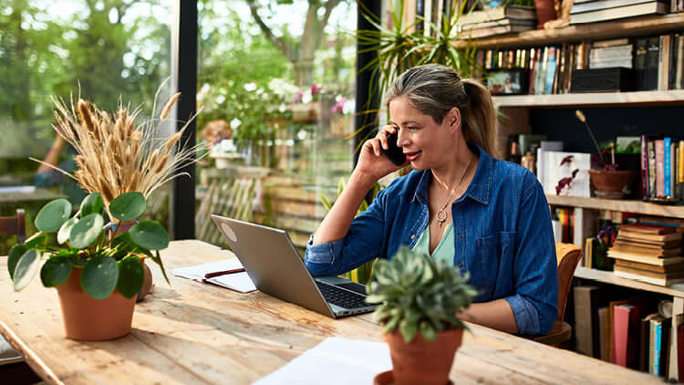 A woman at home checks her finances