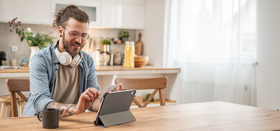 A man at home accessing financial services